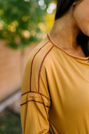 Beyond Compare Contrast Stitch Top In Mustard - ALL SALES FINAL